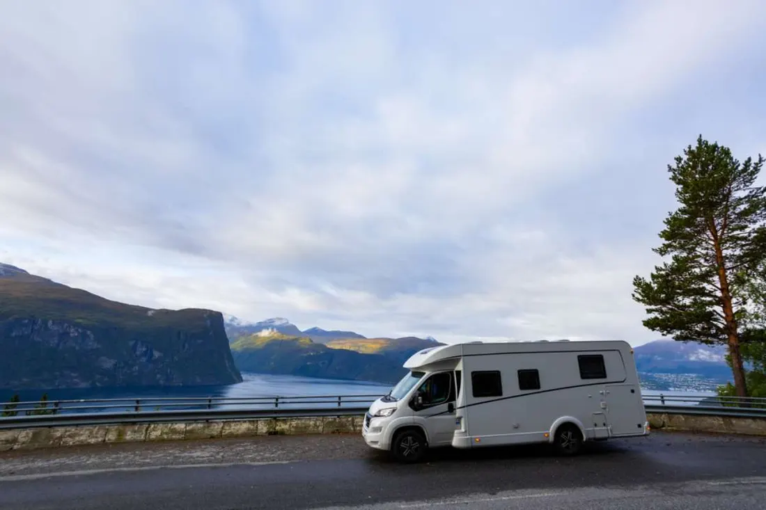Motorhome parked at a viewpoint above a fjord in Norway