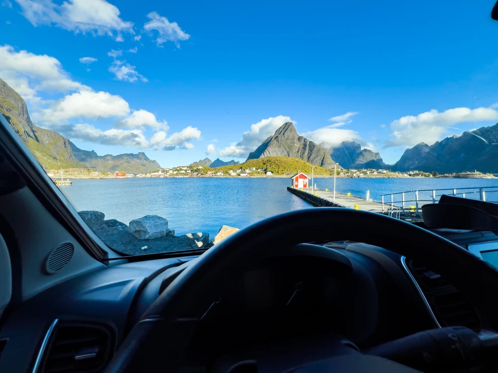 Lofoten mountains and sea seen through the windscreen of a vehicle